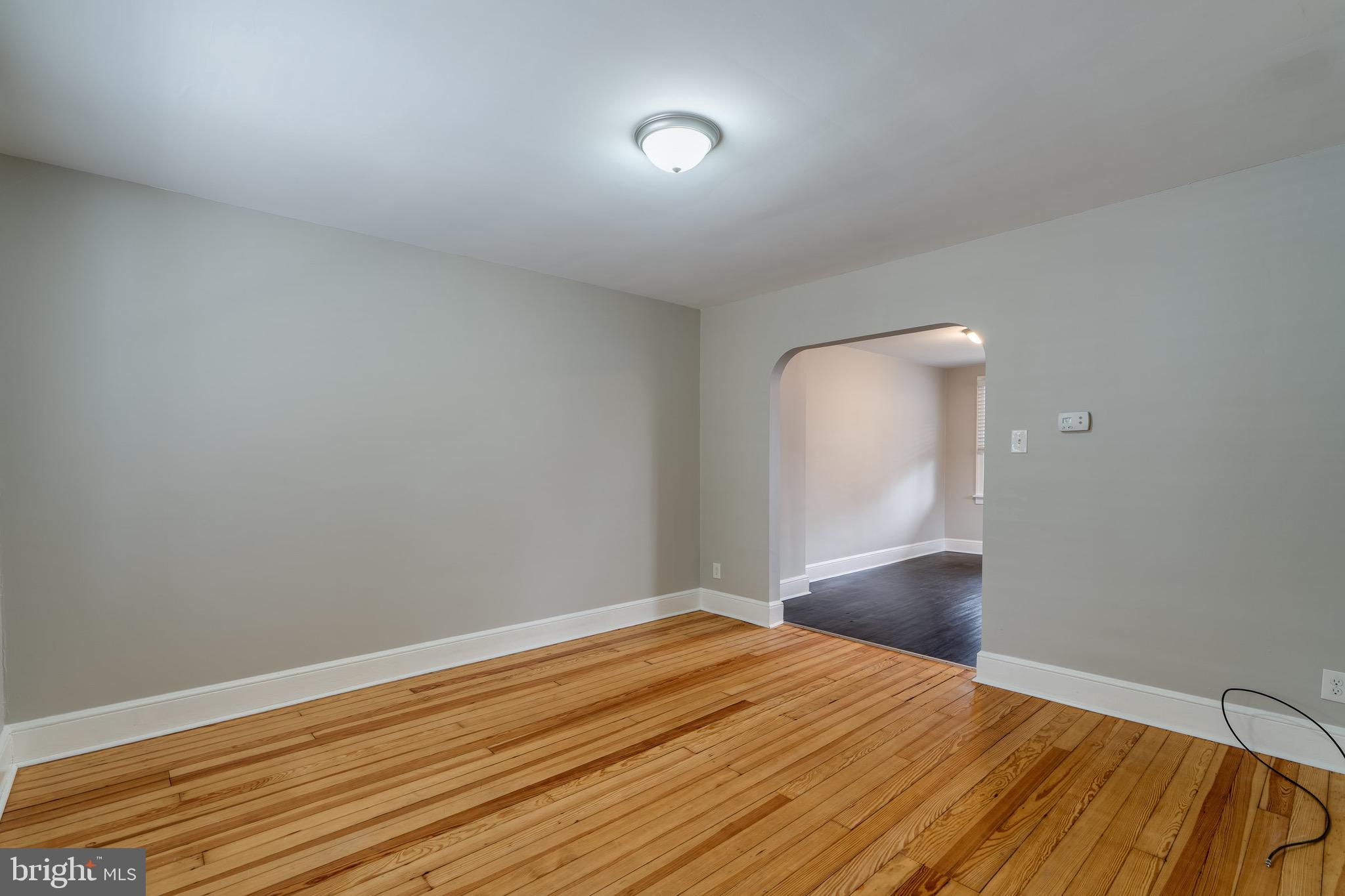 679 Poplar Street Lancaster, PA 17603 - Photo 6 of 32 a view of empty room with wooden floor