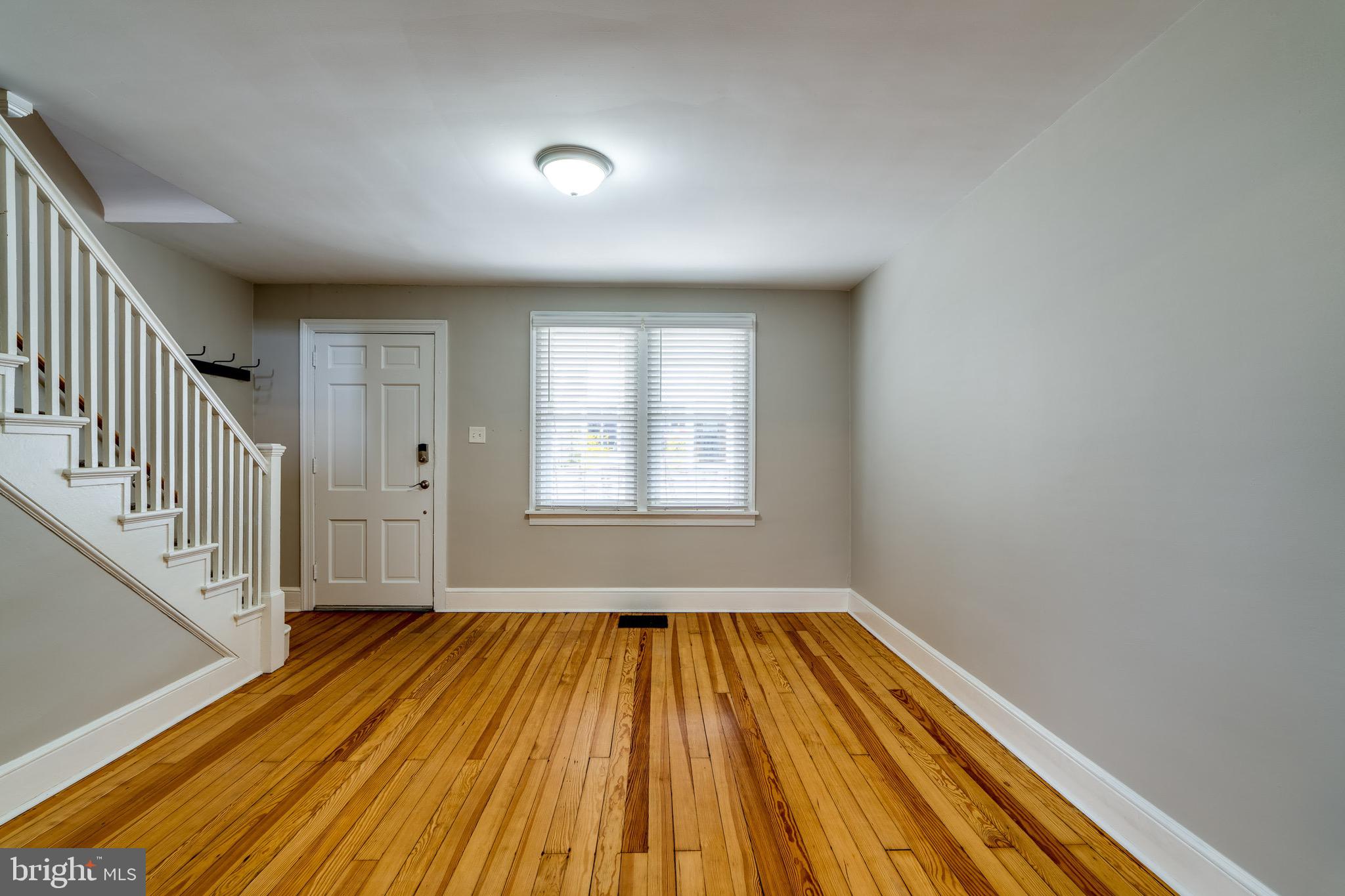 679 Poplar Street Lancaster, PA 17603 - Photo 7 of 32 a view of empty room with wooden floor