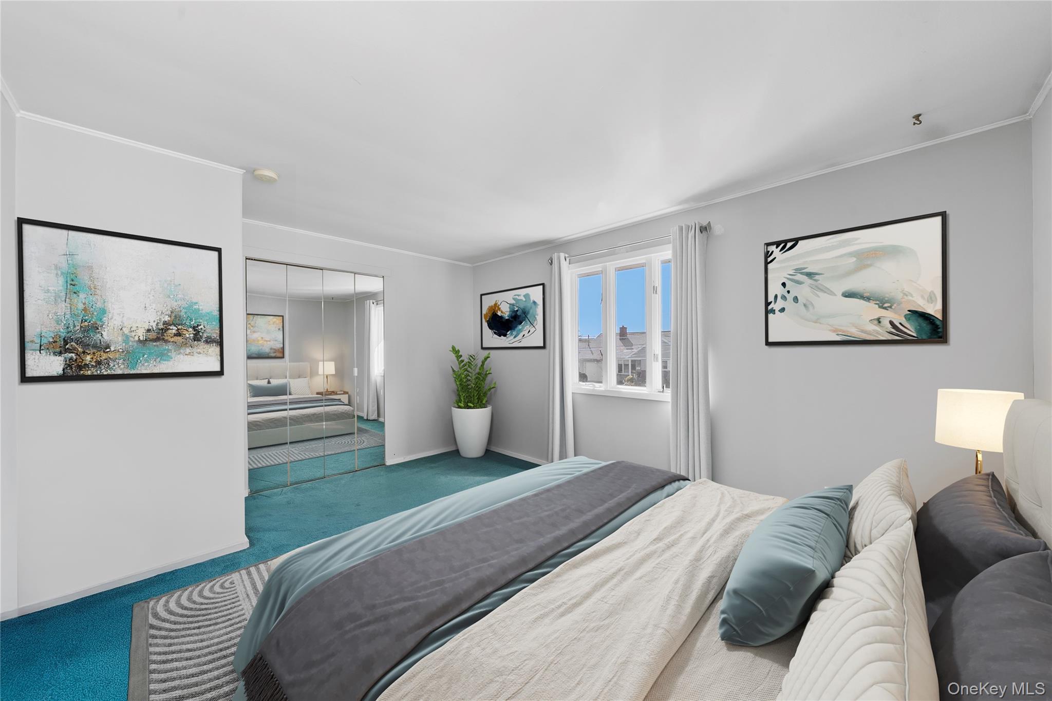 15 Hayes Road Amity Harbor, NY 11701 - Photo 16 of 46 a spacious bedroom with a bed and a couch