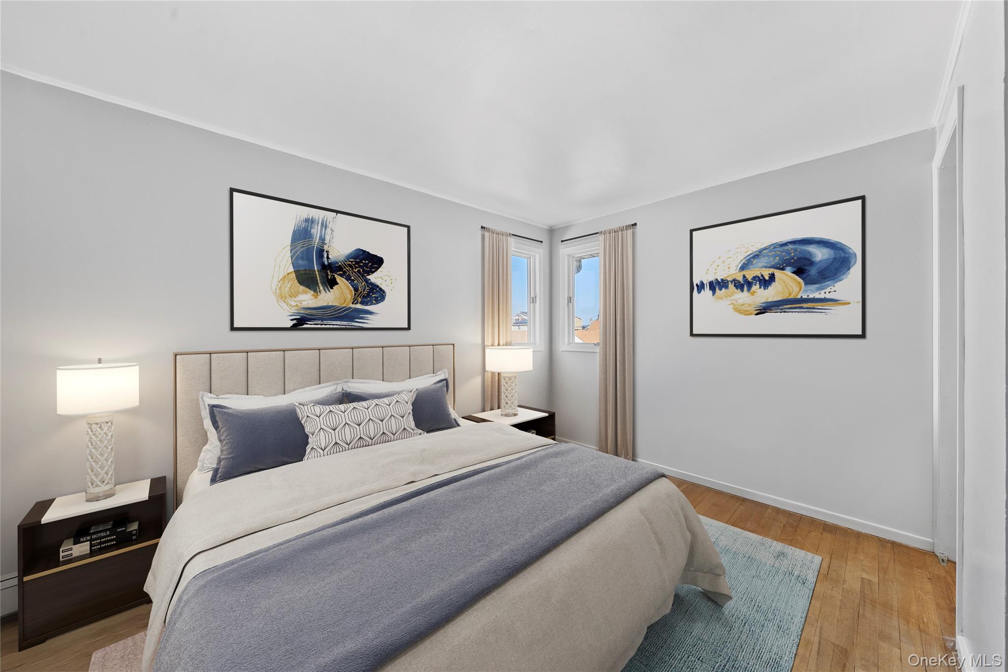 15 Hayes Road Amity Harbor, NY 11701 - Photo 18 of 46 a bedroom with a bed and a painting on the wall