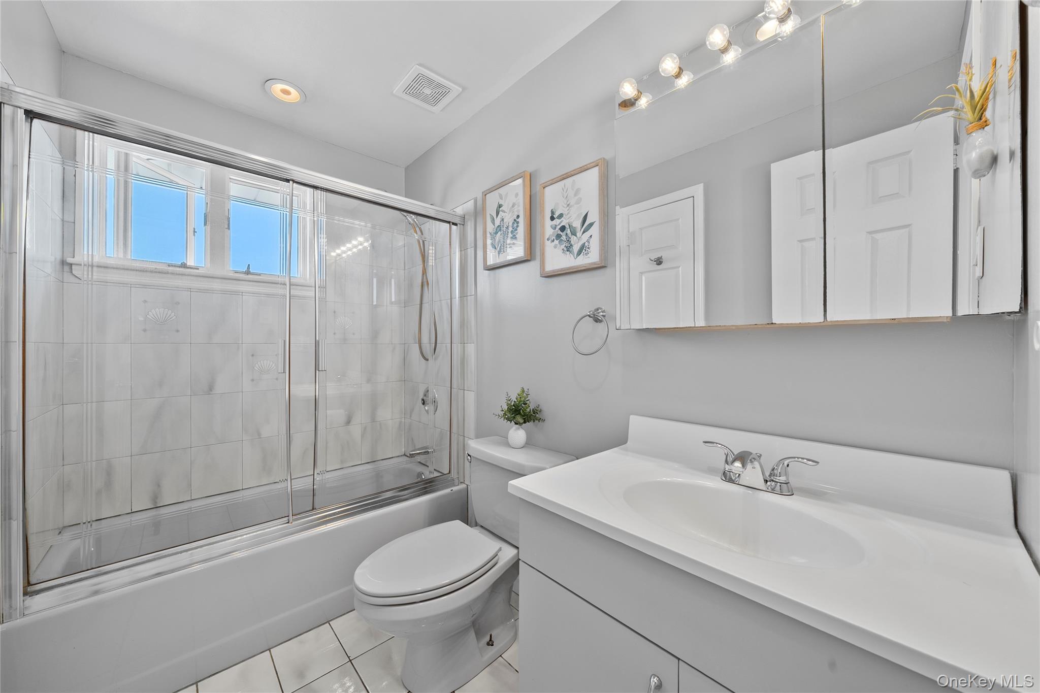 15 Hayes Road Amity Harbor, NY 11701 - Photo 19 of 46 a bathroom with a sink toilet and shower