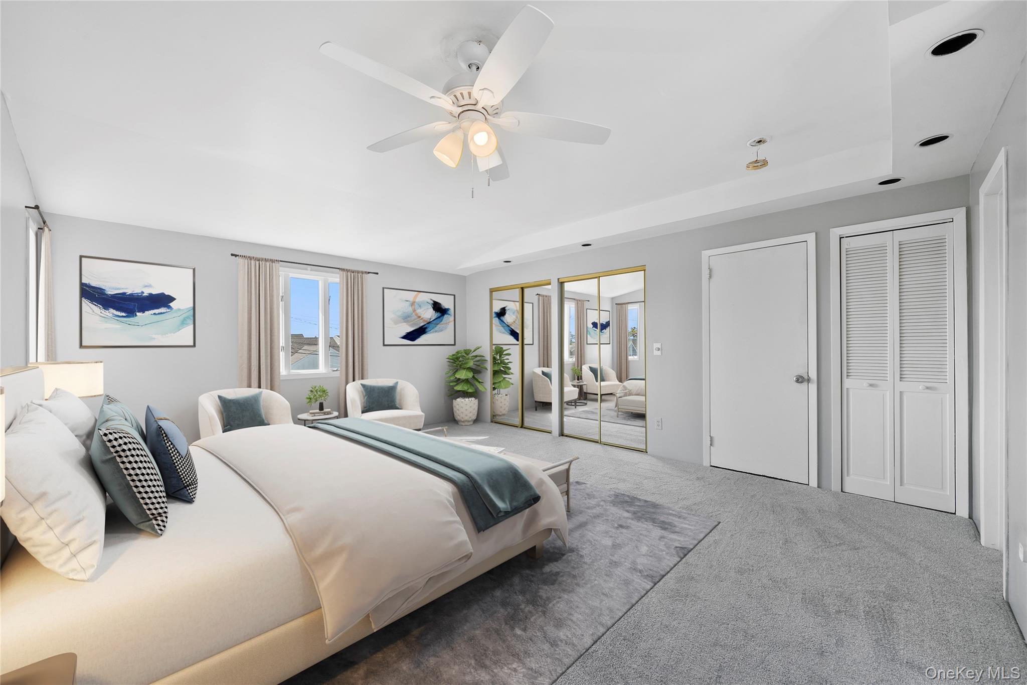 15 Hayes Road Amity Harbor, NY 11701 - Photo 22 of 46 a spacious bedroom with a large bed and a chandelier