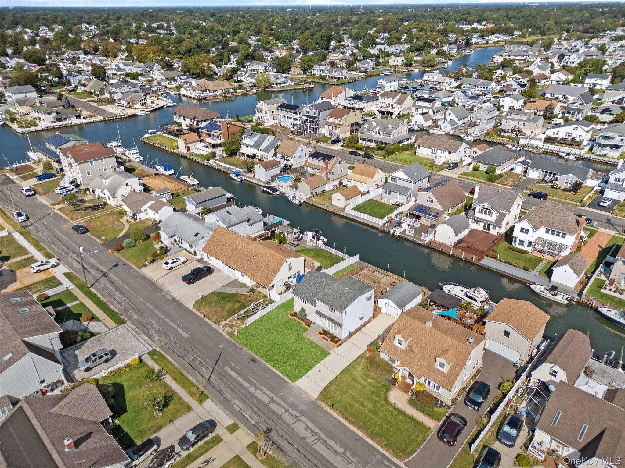 15 Hayes Road Amity Harbor, NY 11701 - Photo 25 of 46 an aerial view of a city with a mountain
