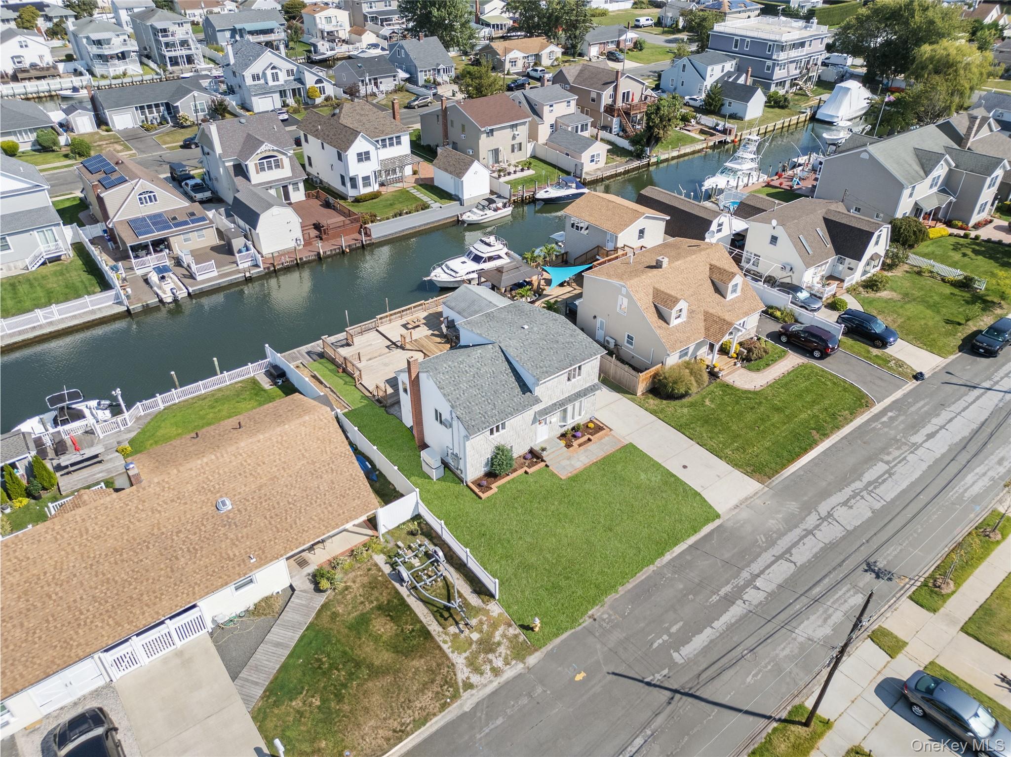 15 Hayes Road Amity Harbor, NY 11701 - Photo 27 of 46 an aerial view of a house with a lake view