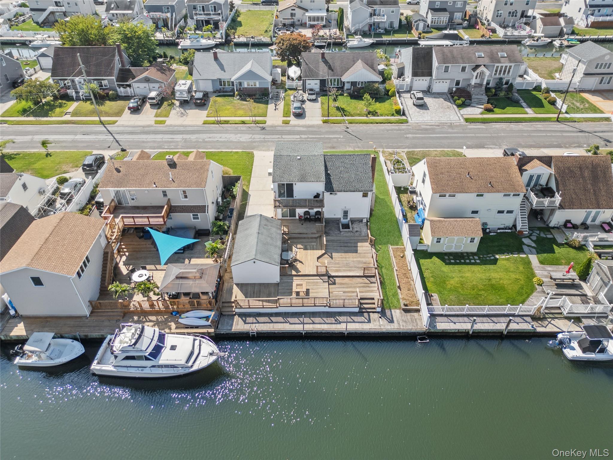 15 Hayes Road Amity Harbor, NY 11701 - Photo 28 of 46 an aerial view of a house with a garden and lake view