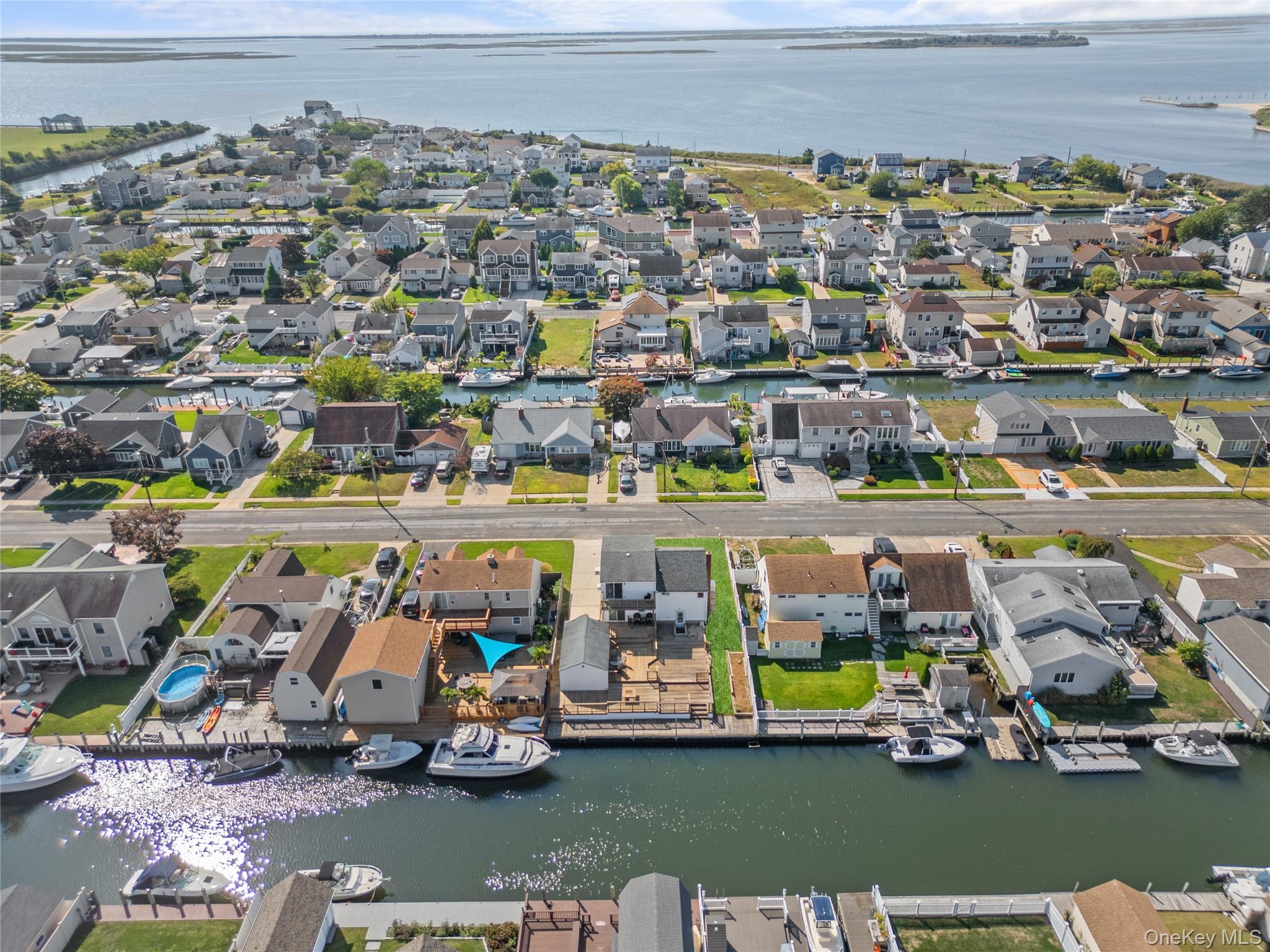 15 Hayes Road Amity Harbor, NY 11701 - Photo 30 of 46 an aerial view of a building with parked cars