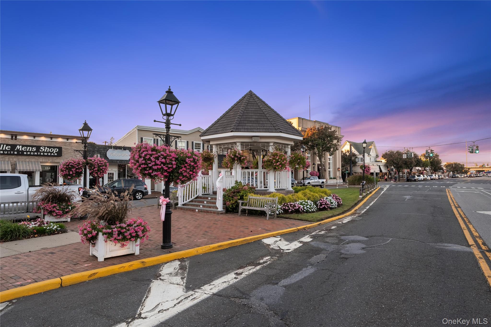 15 Hayes Road Amity Harbor, NY 11701 - Photo 37 of 46 a view of a table and chairs in front of a building
