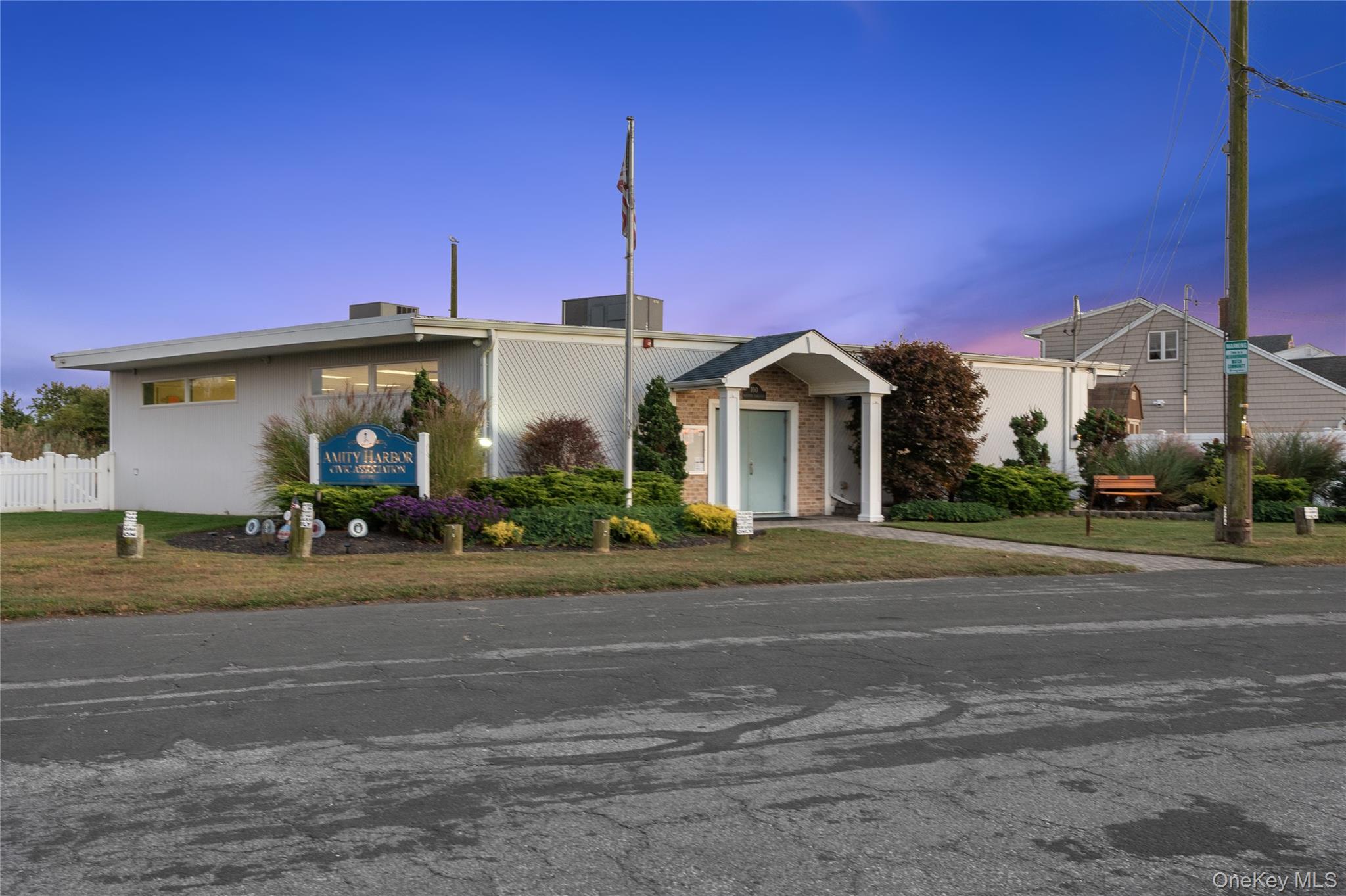15 Hayes Road Amity Harbor, NY 11701 - Photo 41 of 46 a front view of a house with a yard and garage