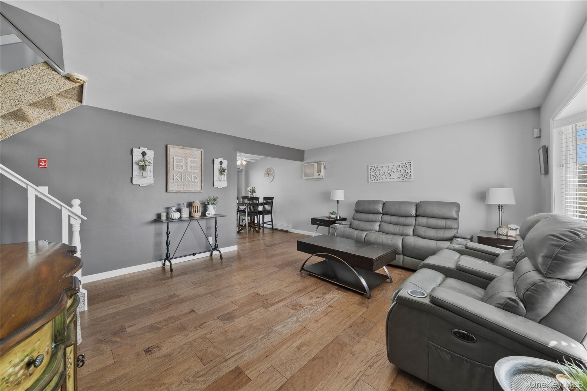 15 Hayes Road Amity Harbor, NY 11701 - Photo 5 of 46 a living room with furniture and wooden floor