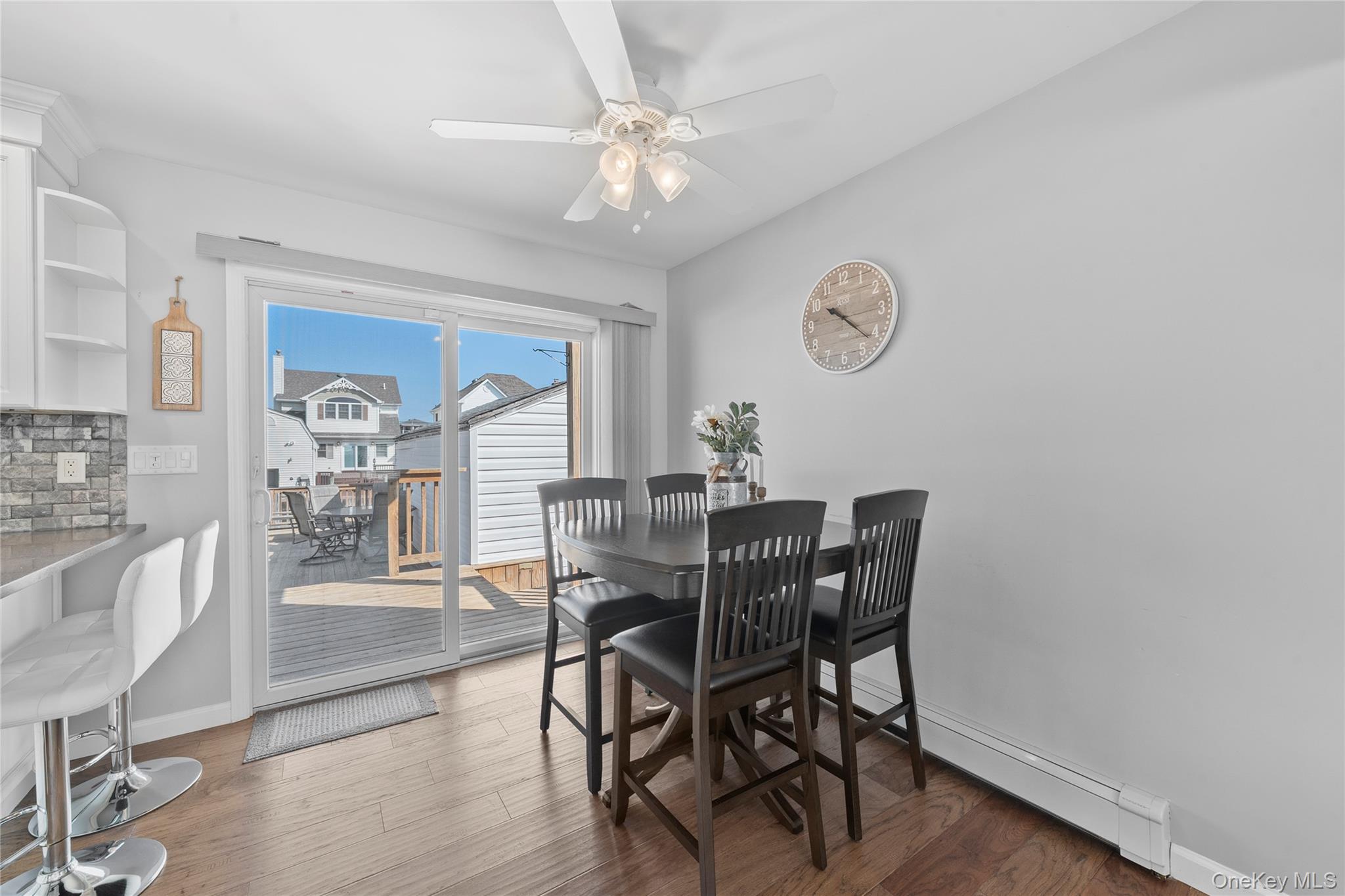 15 Hayes Road Amity Harbor, NY 11701 - Photo 6 of 46 a view of a dining room with furniture window and wooden floor