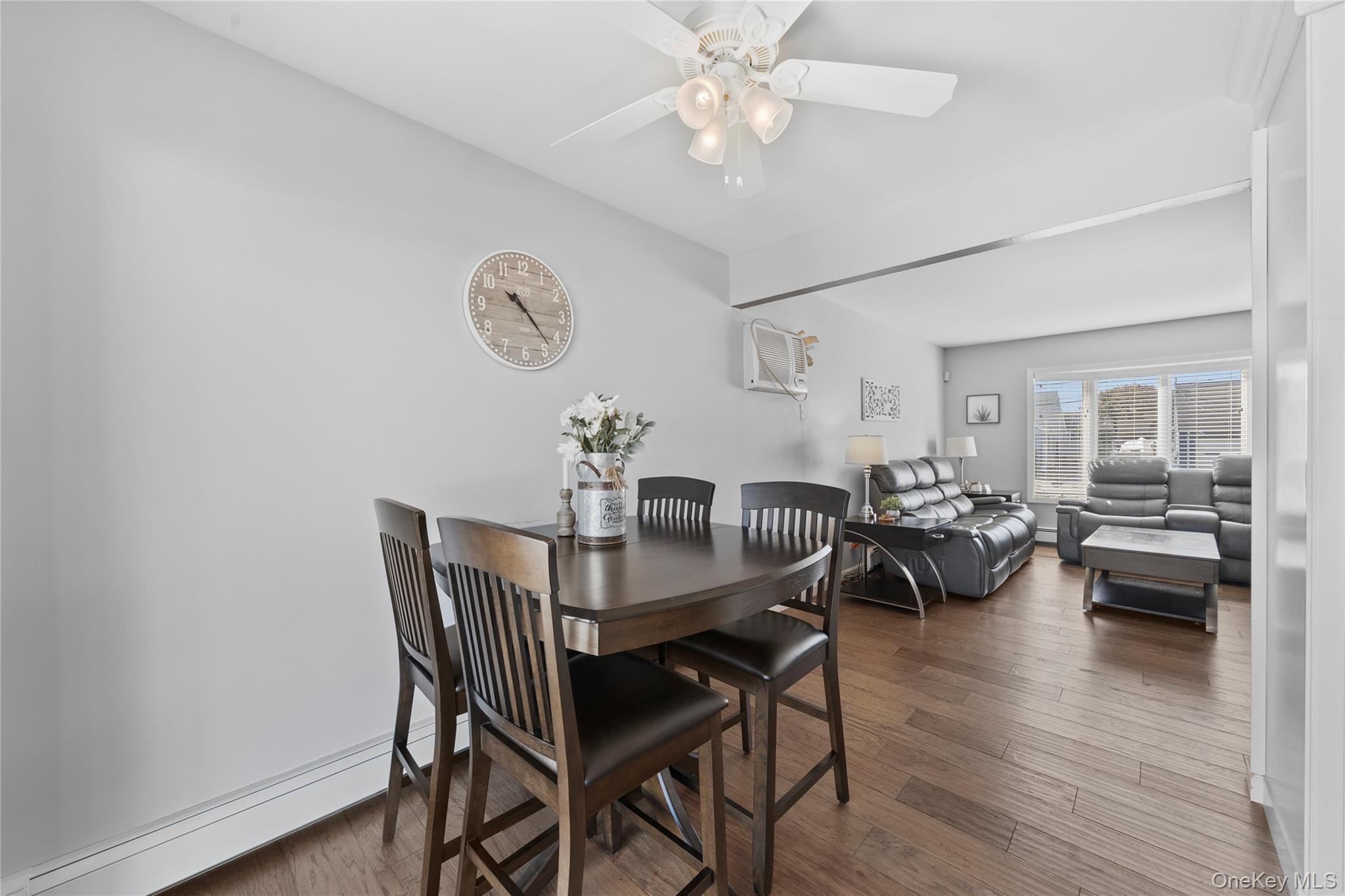 15 Hayes Road Amity Harbor, NY 11701 - Photo 7 of 46 a view of a dining room with furniture and wooden floor
