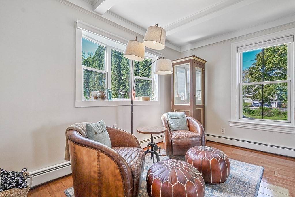 28 Maple Street Mendon, MA 01756 - Photo 11 of 39 a living room with furniture and two large window
