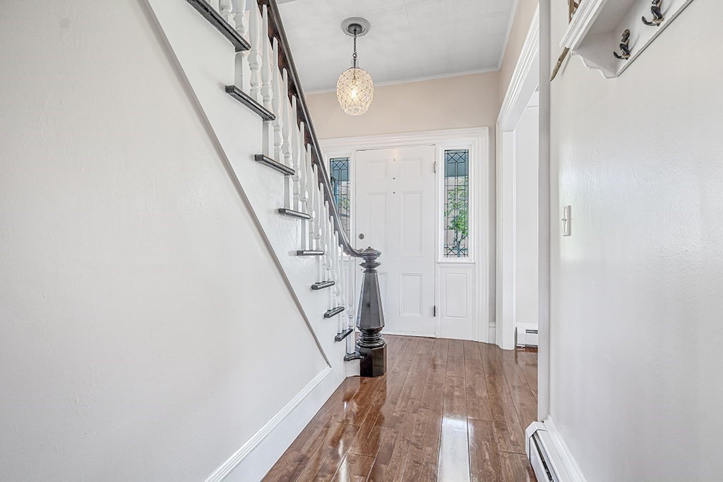 28 Maple Street Mendon, MA 01756 - Photo 12 of 39 a view of entryway with wooden floor and stairs