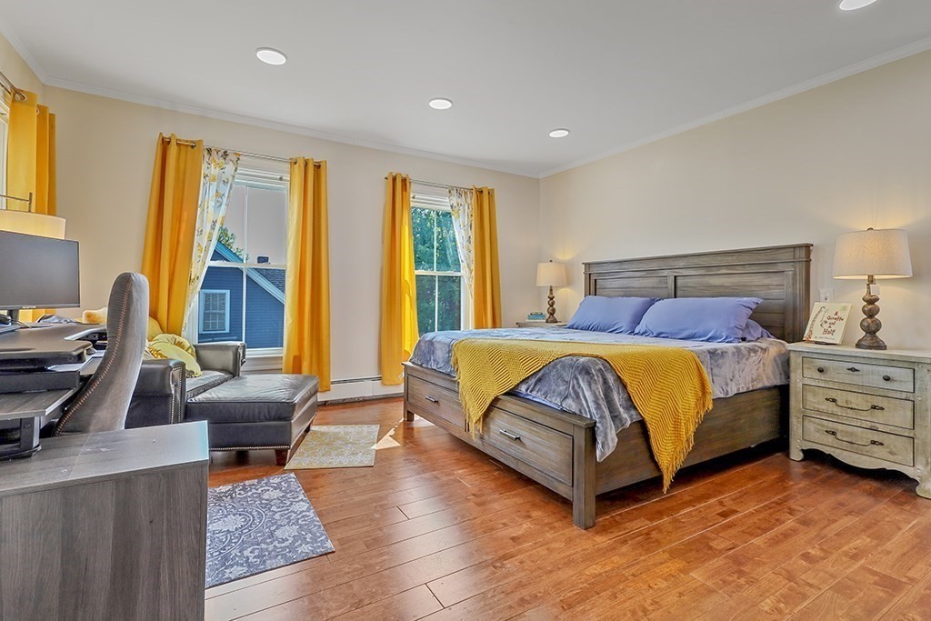 28 Maple Street Mendon, MA 01756 - Photo 24 of 39 a spacious bedroom with a bed and wooden floor