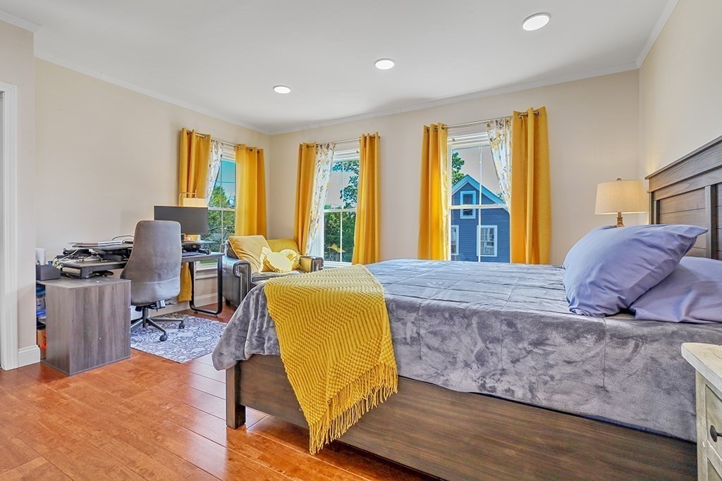28 Maple Street Mendon, MA 01756 - Photo 25 of 39 a living room with furniture and a large window