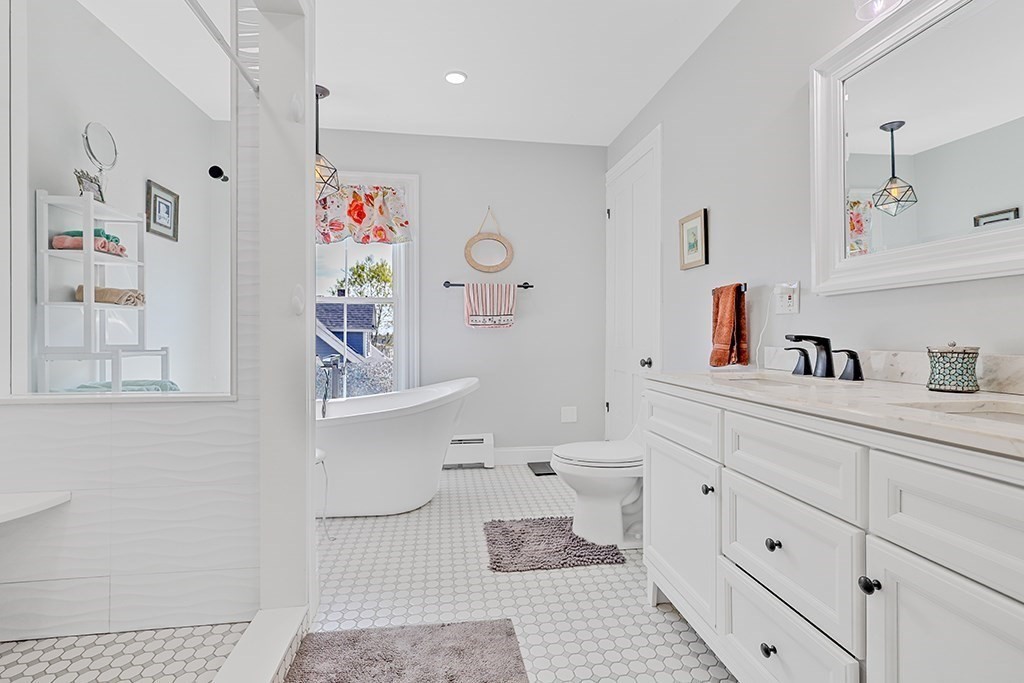 28 Maple Street Mendon, MA 01756 - Photo 26 of 39 a bathroom with a sink a toilet and a shower