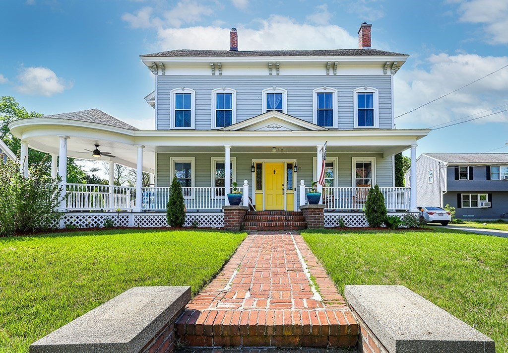 28 Maple Street Mendon, MA 01756 - Photo 3 of 39 a front view of a house with garden and porch