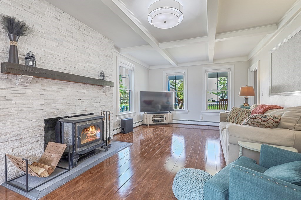 28 Maple Street Mendon, MA 01756 - Photo 7 of 39 a living room with furniture and a fireplace
