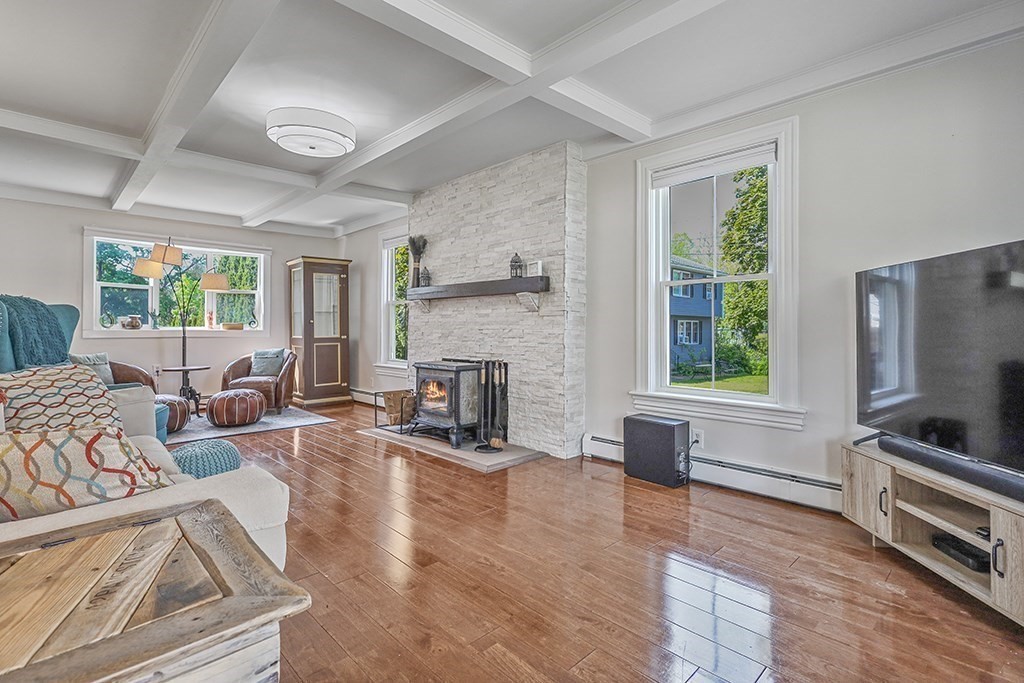 28 Maple Street Mendon, MA 01756 - Photo 8 of 39 a living room with furniture window and a fireplace