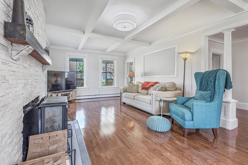 28 Maple Street Mendon, MA 01756 - Photo 10 of 39 a living room with furniture and a flat screen tv