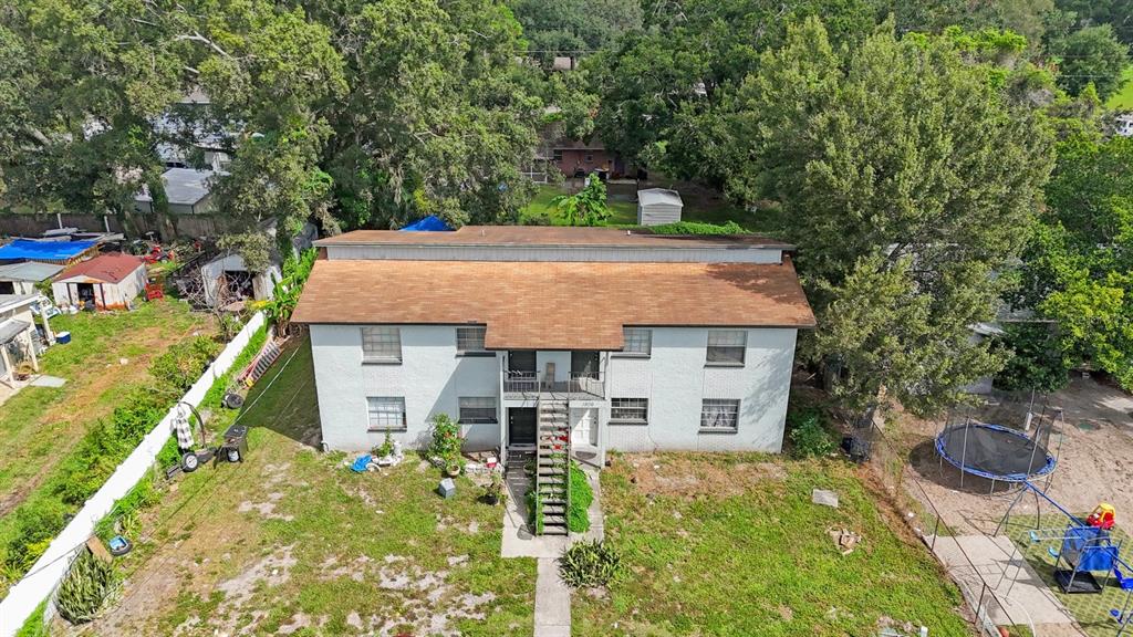 1806 East 138th Avenue Tampa, FL 33613 - Photo 3 of 19 front view of a house with a yard