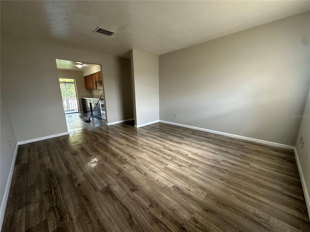 1806 East 138th Avenue Tampa, FL 33613 - Photo 4 of 19 a view of an empty room and fire place