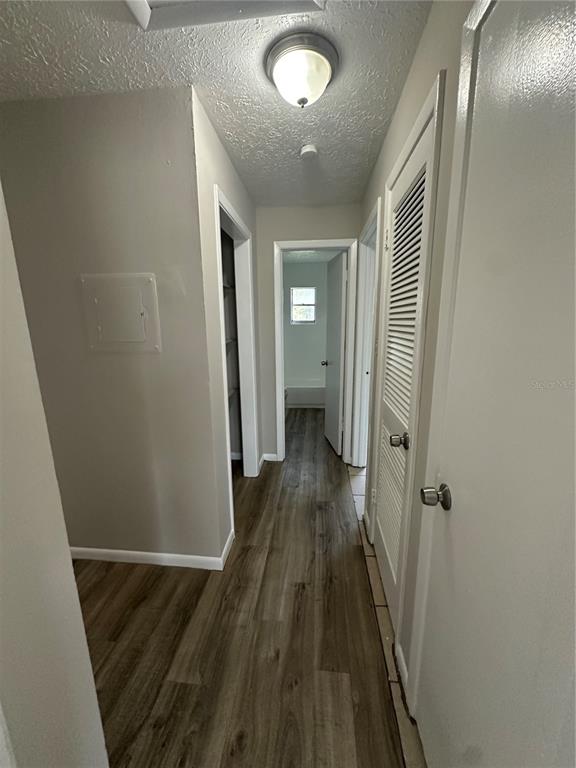 1806 East 138th Avenue Tampa, FL 33613 - Photo 8 of 19 a view of a hallway with wooden floor and staircase