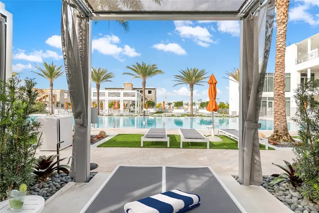 a view of swimming pool with seating area