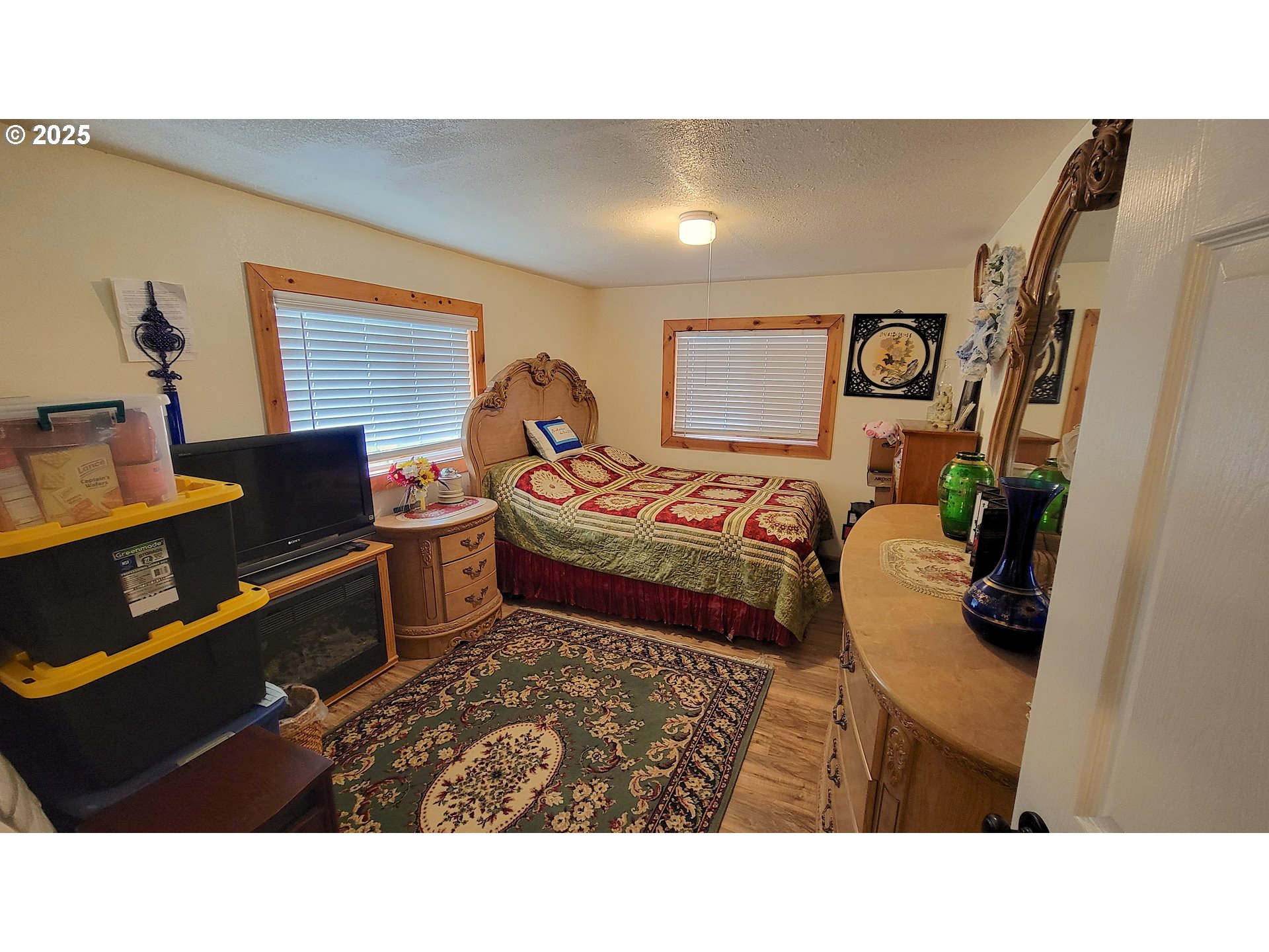 40300 Kahler Basin Road Spray, OR 97874 - Photo 11 of 26 a living room with furniture and a flat screen tv