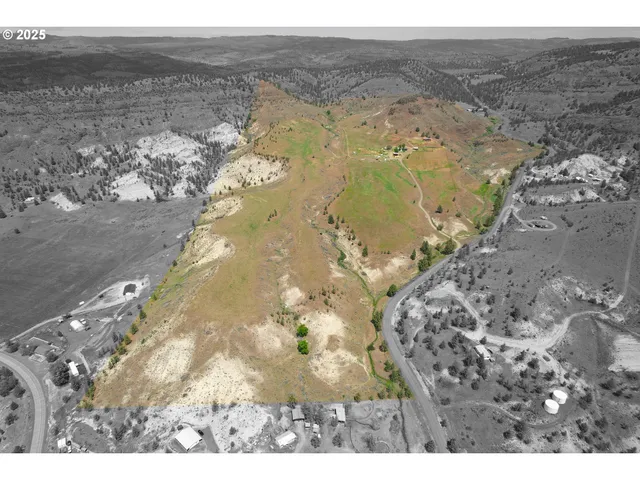 a aerial view of a house with a yard