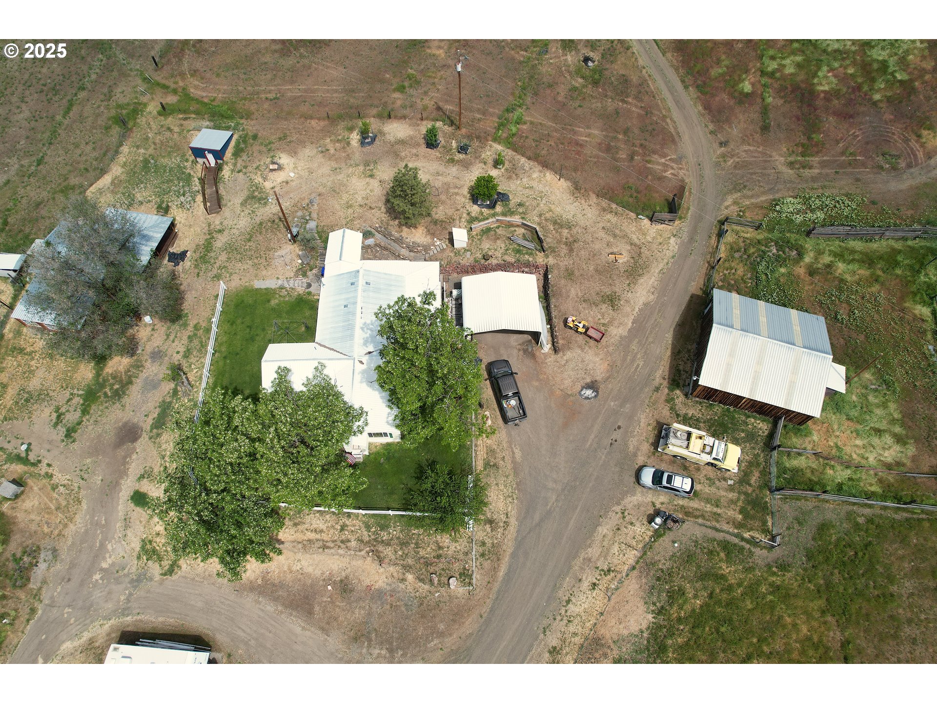 40300 Kahler Basin Road Spray, OR 97874 - Photo 24 of 26 a view of a house with a yard