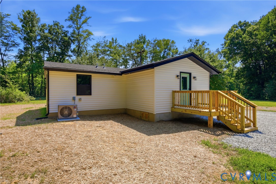 3497 Bumpass Road Beaverdam, VA 23015 - Photo 20 of 28 Modern white siding exterior with a contrasting da