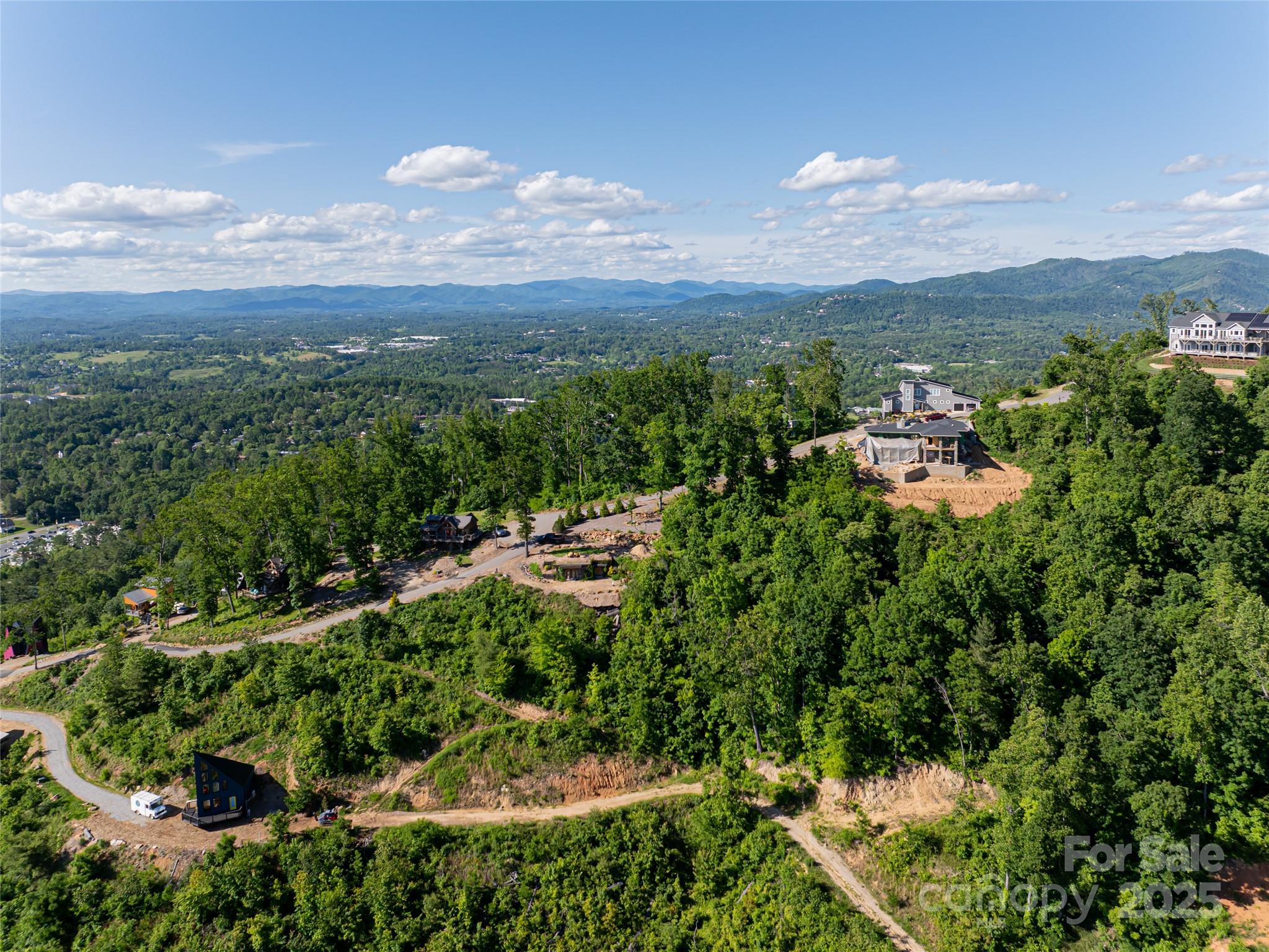 151 Serenity Ridge Trail Asheville, NC 28804 - Photo 4 of 16 a view of a lake with a mountain