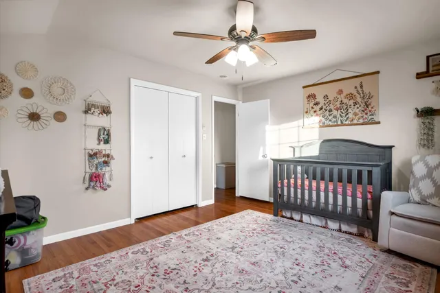 a view of a chair and table in the backyard