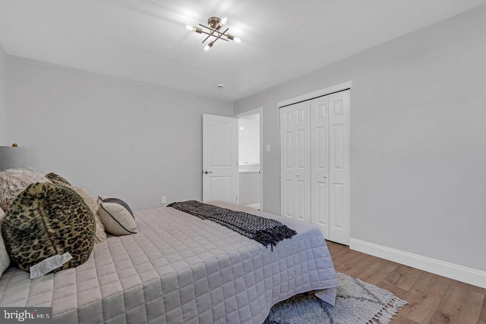 328 Ithaca Avenue Delran, NJ 08075 - Photo 14 of 24 a bedroom with a bed and a chandelier