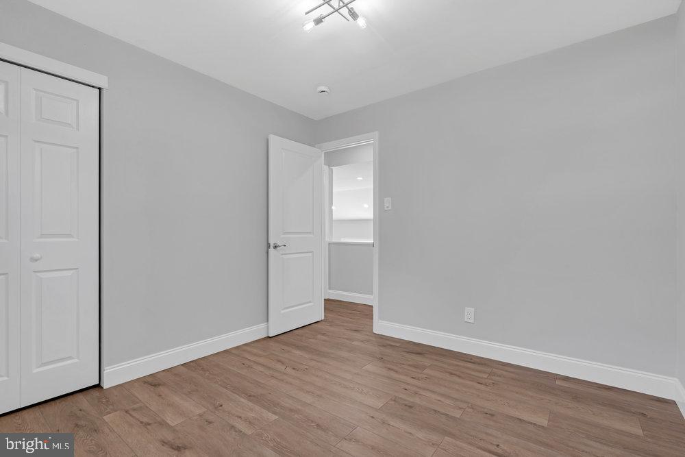 328 Ithaca Avenue Delran, NJ 08075 - Photo 15 of 24 a view of an empty room with wooden floor and a window