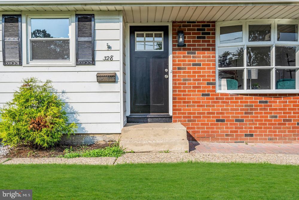328 Ithaca Avenue Delran, NJ 08075 - Photo 2 of 24 a front view of a house with a garden