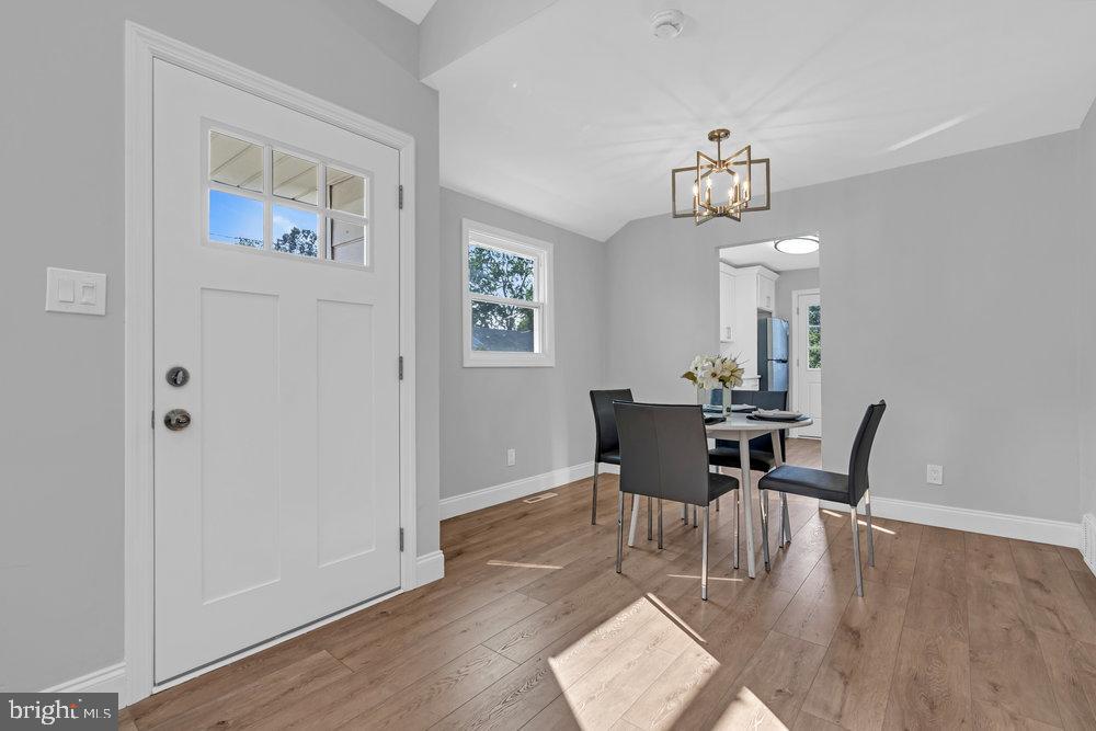 328 Ithaca Avenue Delran, NJ 08075 - Photo 9 of 24 a view of a dining room with furniture wooden floor and a chandelier
