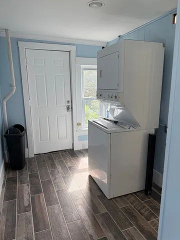 a kitchen with granite countertop a sink and a stove next to a window