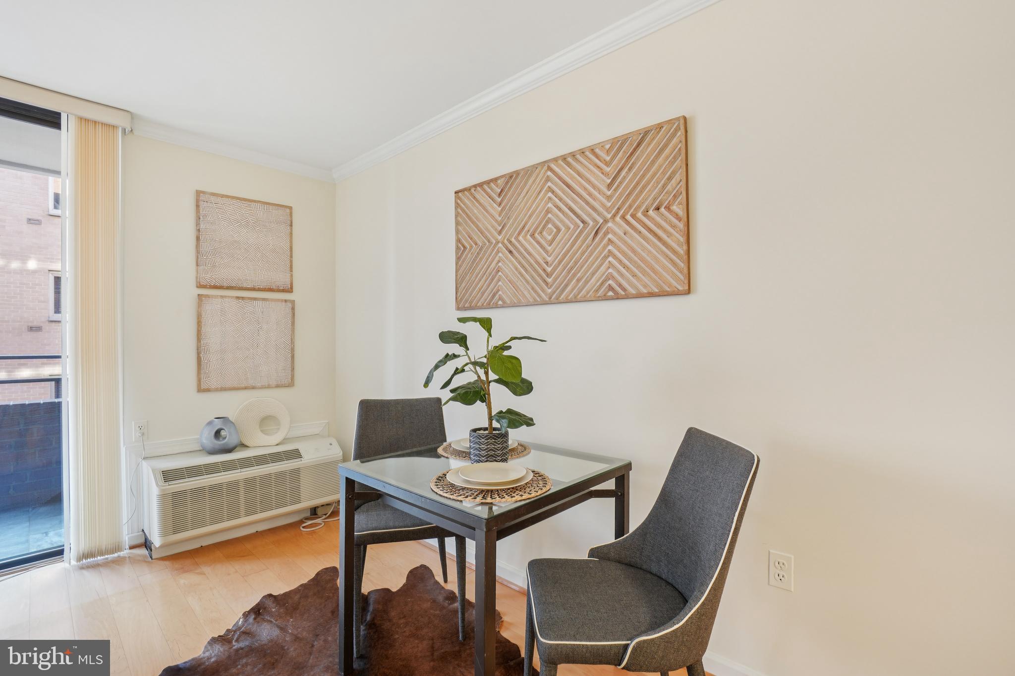 2141 P Street Northwest, Unit 709 Washington, DC 20037 - Photo 11 of 23 a dining room with furniture and window
