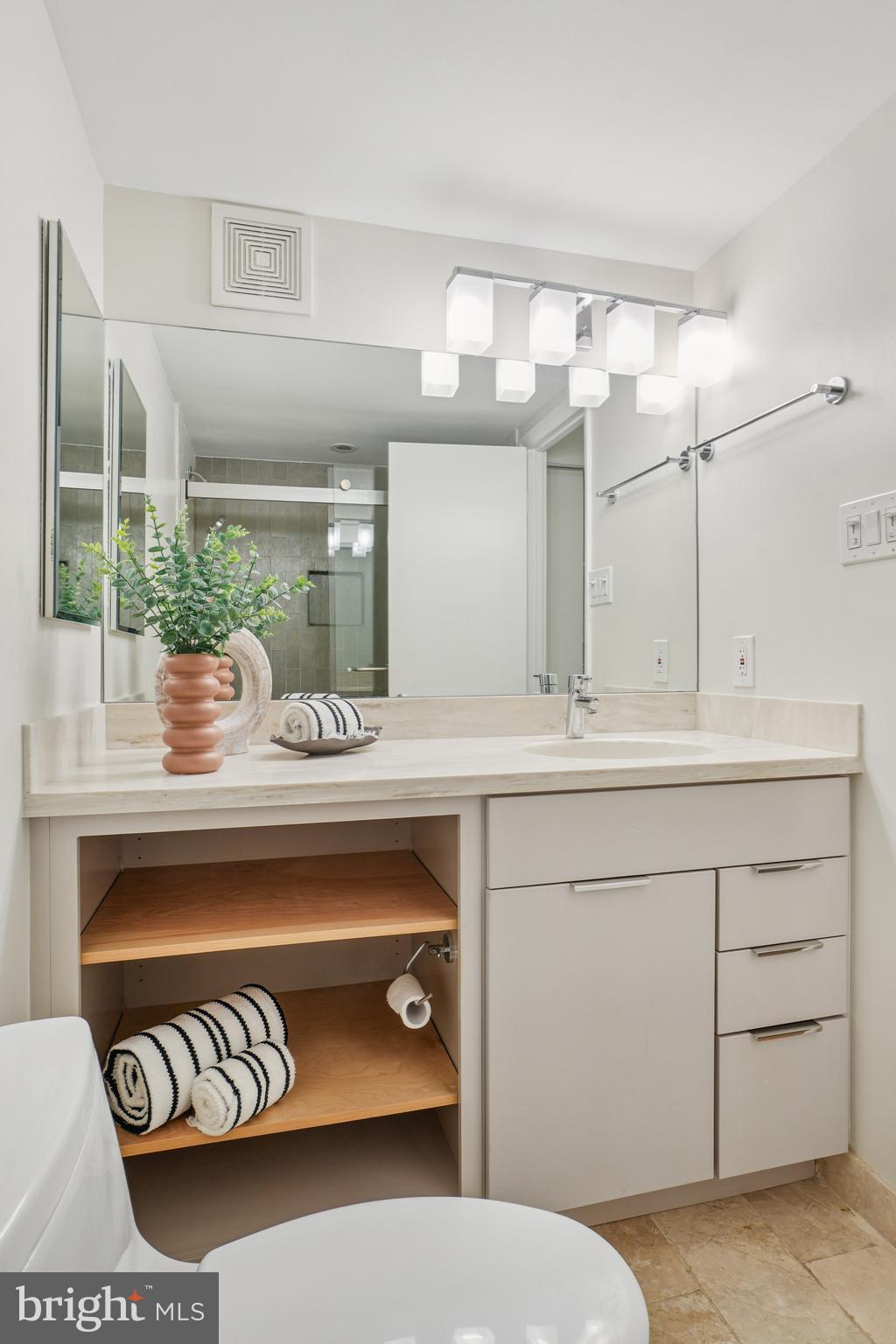 2141 P Street Northwest, Unit 709 Washington, DC 20037 - Photo 17 of 23 a bathroom with a sink and a mirror