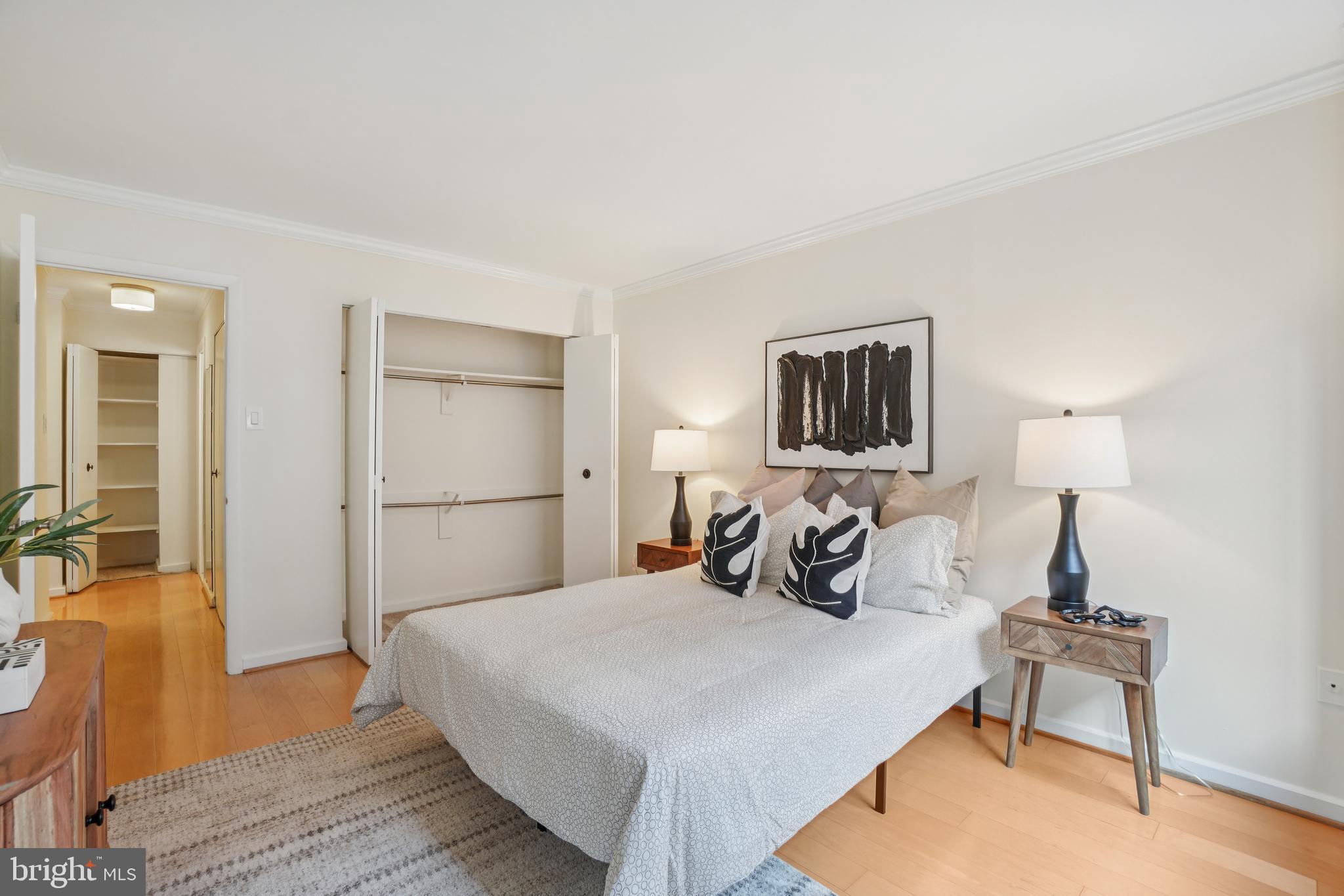 2141 P Street Northwest, Unit 709 Washington, DC 20037 - Photo 20 of 23 a bedroom with a bed and wooden floor