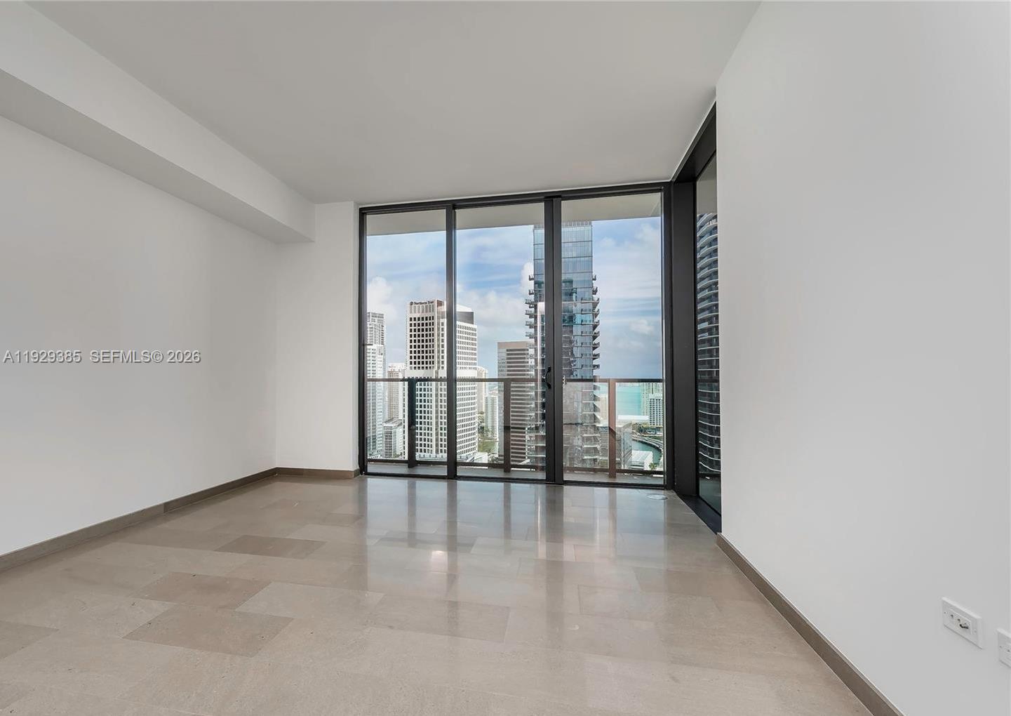 88 Southwest 7th Street, Unit 2501 Miami, FL 33130 - Photo 11 of 38 wooden floor in an empty room with a window