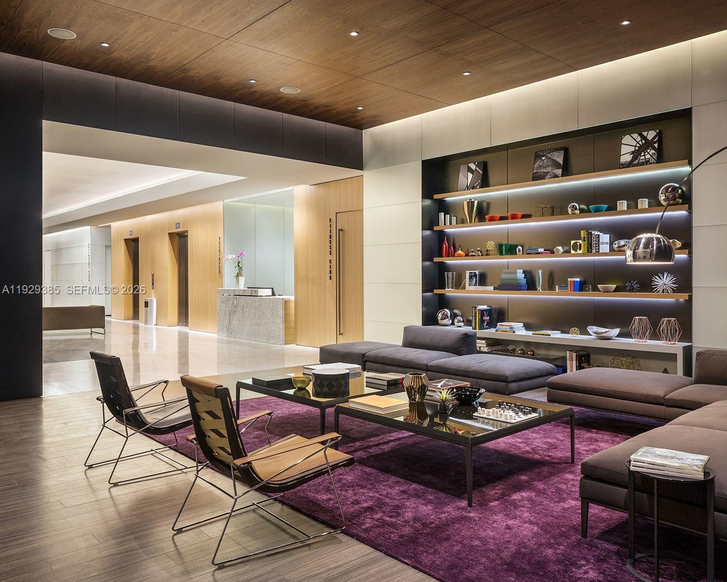 88 Southwest 7th Street, Unit 2501 Miami, FL 33130 - Photo 31 of 38 a living room with furniture a rug and a chandelier