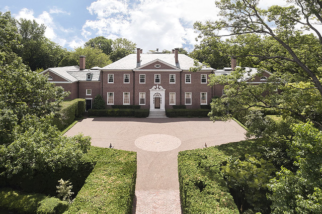 965 East Deerpath Road Lake Forest, IL 60045 - Photo 1 of 25 a front view of a house with a yard and garage