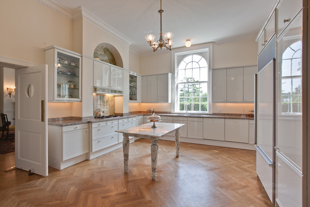 965 East Deerpath Road Lake Forest, IL 60045 - Photo 14 of 25 a room with kitchen island granite countertop wooden floors granite top and stainless steel appliances
