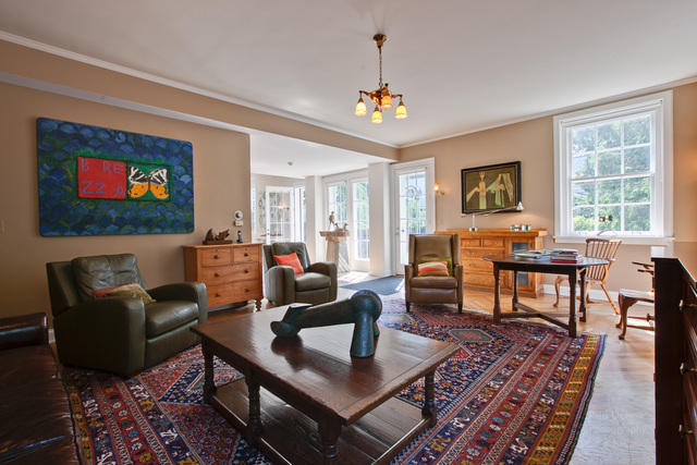 965 East Deerpath Road Lake Forest, IL 60045 - Photo 16 of 25 a living room with furniture a chandelier and a flat screen tv