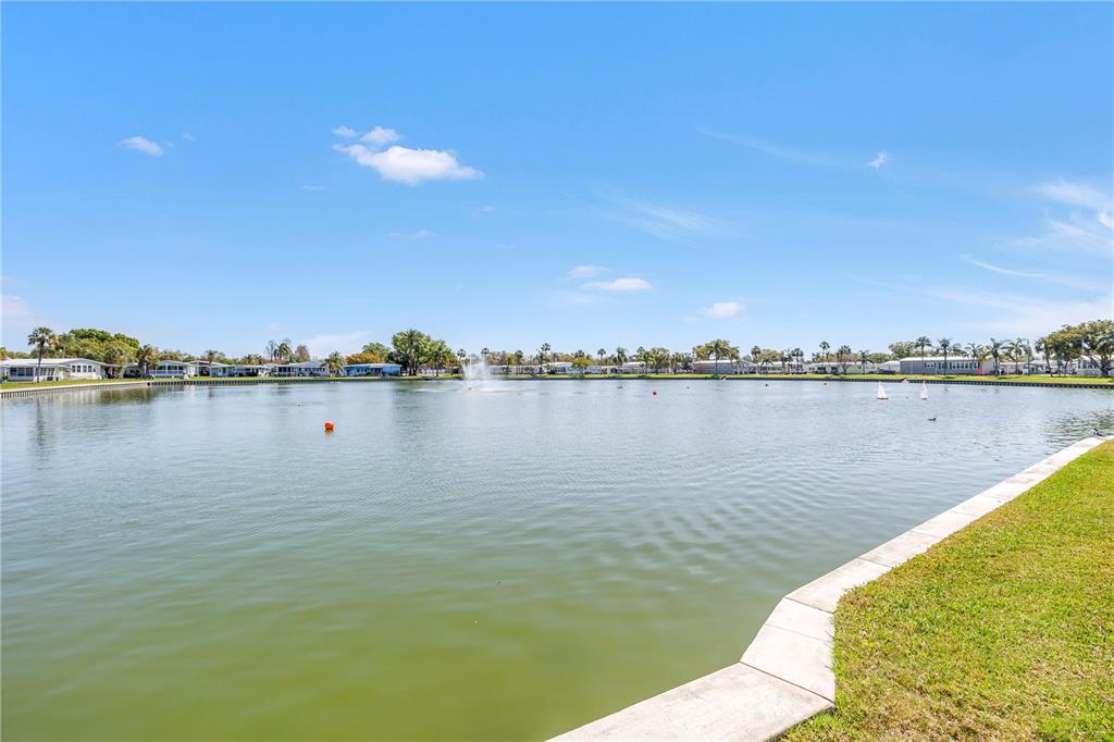 1100 South Belcher Road, Unit 502 Largo, FL 33771 - Photo 37 of 51 a view of a lake with houses in the background