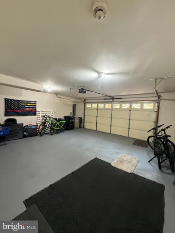 a spacious bedroom with a large bed and a large window