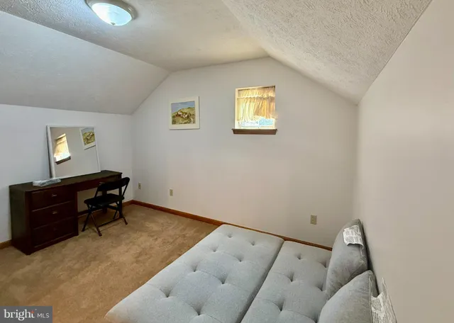 a kitchen with sink refrigerator and cabinets